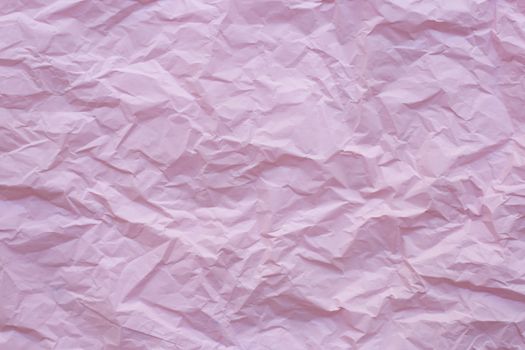 Pink crumpled recycle paper background