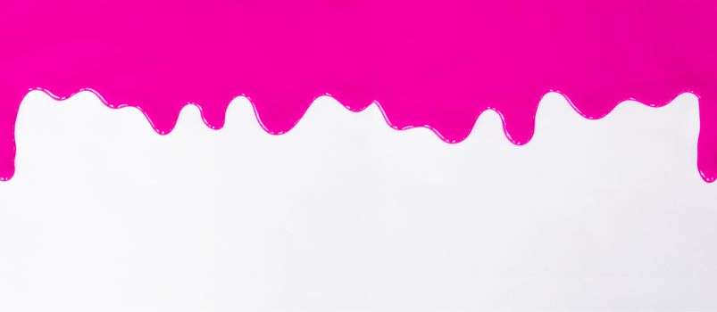 Pink paint dripping on a white background