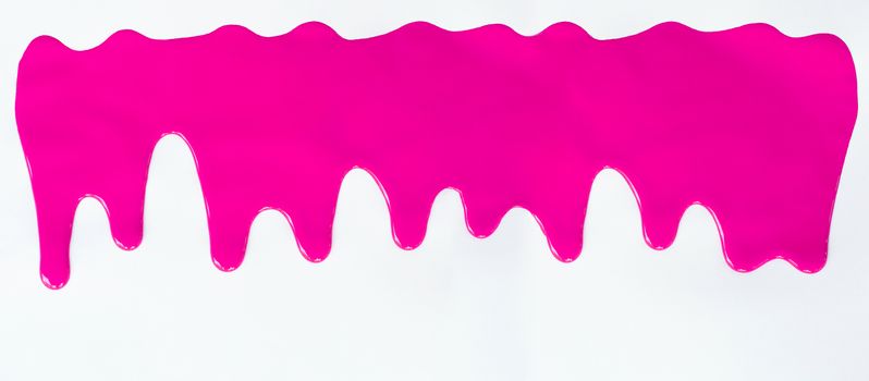 Pink paint dripping on a white background