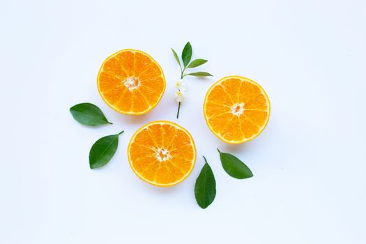 High vitamin C, Orange fruits with leaves on white background. Top view