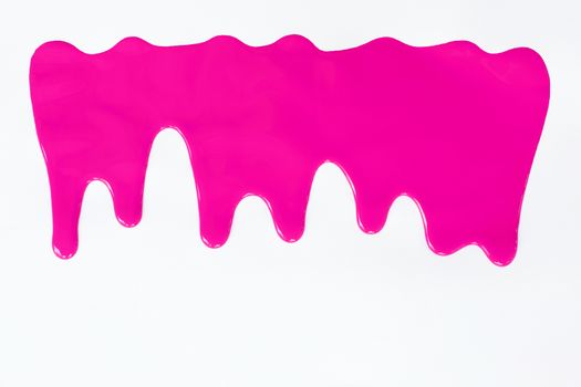 Pink paint dripping on a white background