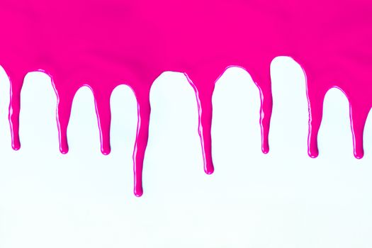 Pink paint dripping on a white background