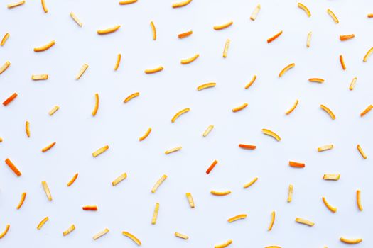 Orange peels on white background. top view