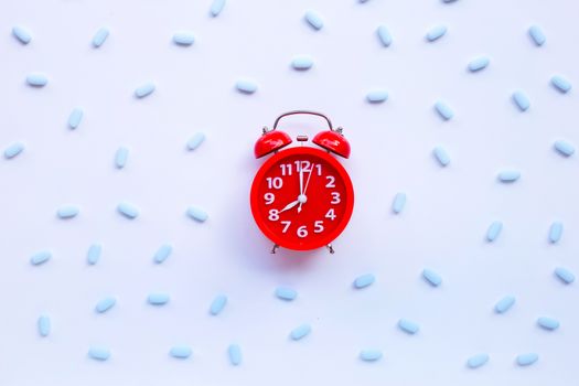 Red alarm clock ring with "PrEP" ( Pre-Exposure Prophylaxis). used to prevent HIV.