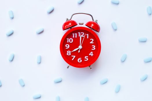 Red alarm clock ring with "PrEP" ( Pre-Exposure Prophylaxis). used to prevent HIV.