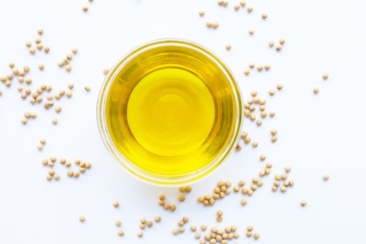 Soy beans and oil isolated on white. Top view