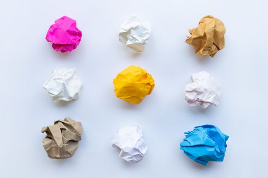Colorful crumpled paper ball isolated on white background