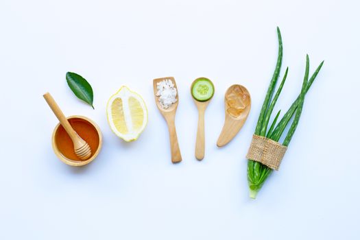 Natural ingredients for homemade skin care on white.
