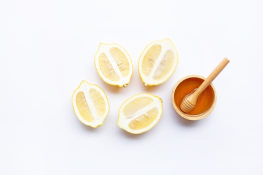 Honey with lemon on white background. Copy space