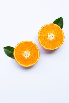 Fresh orange citrus fruits with leaves on white background.  Top view