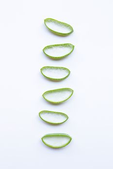 Aloe vera slices on white background.