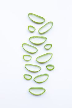 Aloe vera slices on white background.