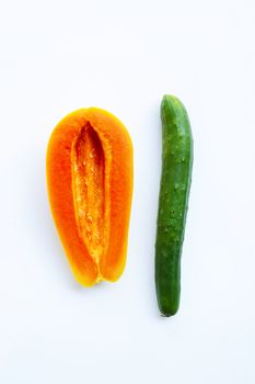 Cucumber and papaya on a white background. Sex concept