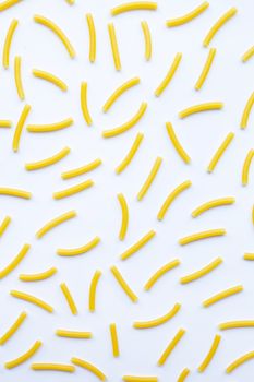 Different types of dry pasta on white background