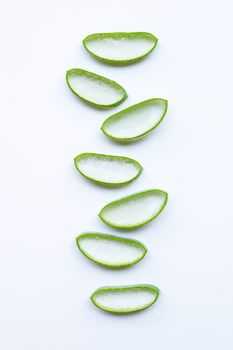 Aloe vera slices on white background.