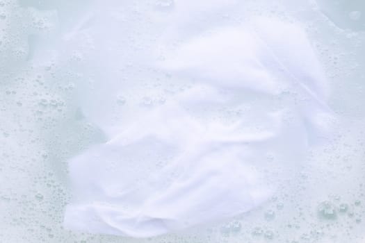 Soak a cloth before washing, white cloth