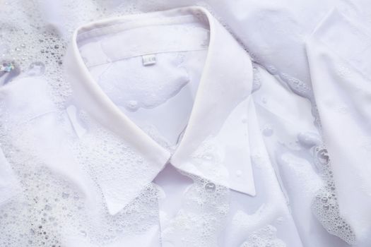 Soak a cloth before washing, white shirt