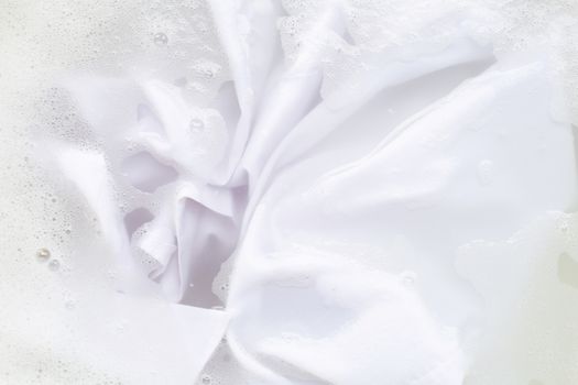 Soak a cloth before washing, white shirt