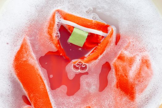 Soak a cloth before washing, Orange polo shirt