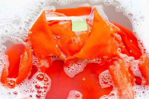 Soak a cloth before washing, Orange polo shirt