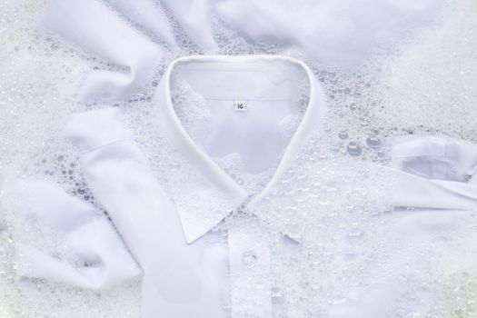 Soak a cloth before washing, white shirt