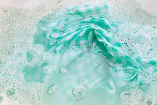 Soak a green white tablecloth before washing