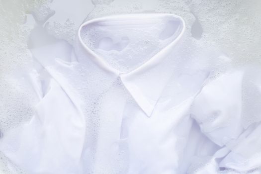 Soak a cloth before washing, white shirt