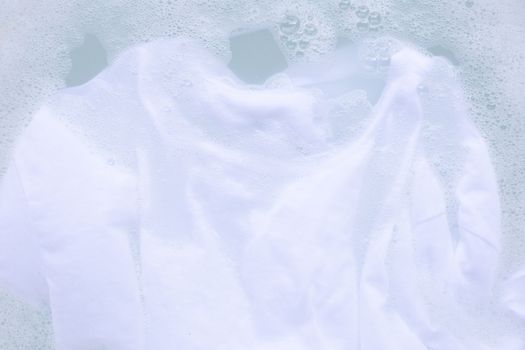 Soak a cloth before washing, white T-shirt