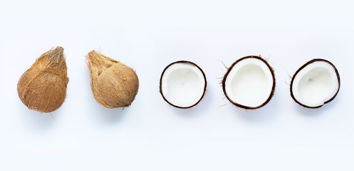 Ripe coconuts on white background. Top view of tropical fruit.