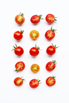 Fresh tomatoes, whole and half cut isolated on white background. Top view