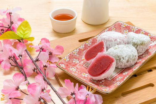 Daifuku traditional Japanese dessert eaten with tea background.