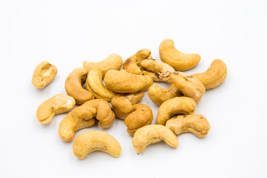 Some cashews were placed on a white ground.