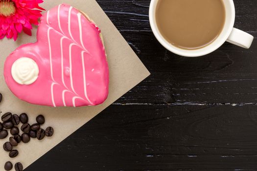 Fresh donut or doughnut with cup of hot coffee for relaxing moment.