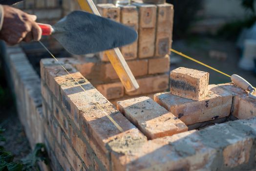 Blurred motion of grip pointing trowel being used