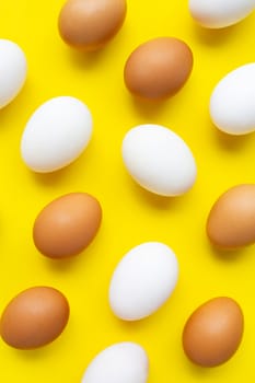 Eggs on yellow background.  Top view