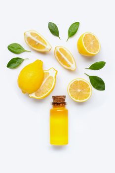 Fresh lemon with lemon essential oil on white background