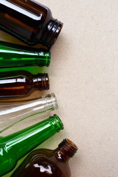 Glass bottles on wooden background. Copy space