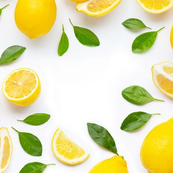 Frame made of fresh lemon and  slices with leaves isolated on white background.