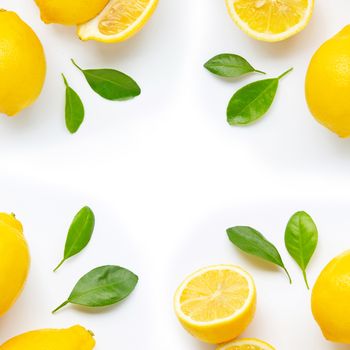 Frame made of fresh lemon and  slices with leaves isolated on white background.