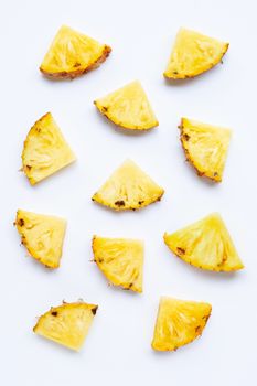 Pineapple slices on white background.