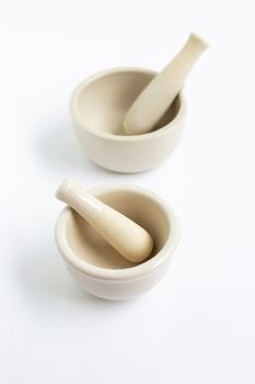 Mortar and pestle on white background.