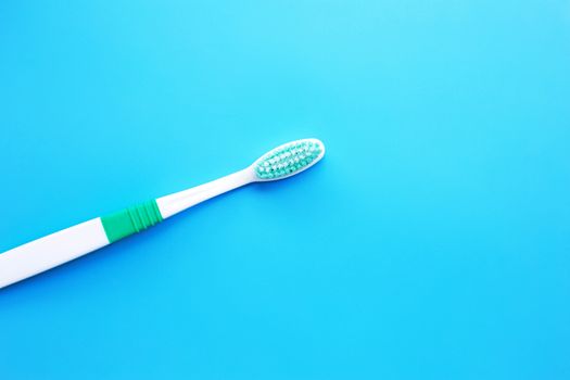 Top view of Toothbrush on blue background. Copy space