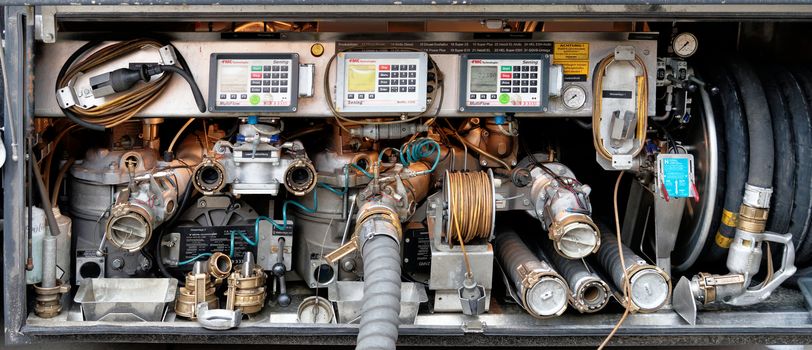 Wolfenbuettel, Lower Saxony, Germany, January 12,2018: Fittings, connections, pressure gauges and measuring instruments on a tanker for fuel and heating oil on delivery.