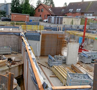 Brunswick, Lower Saxony, Germany, January 6,2018: Construction site of the basement for the construction of a new house for many families in a suburb of Germany.
