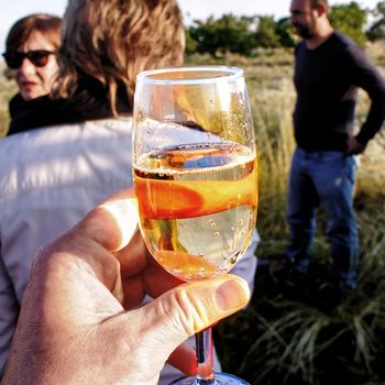 Goereme, Anatolia, Turkey, July 3rd 2015: A glass of sparkling wine for the baptism of balloonists after the trip over the rocky landscape of Cappadocia.