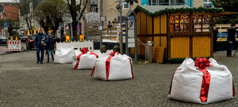 Gifhorn, Lower Saxony, Germany, December 2,2017: Edge of the Christmas Market with Barriers camouflaged as gifts to protect against terrorist attacks with trucks