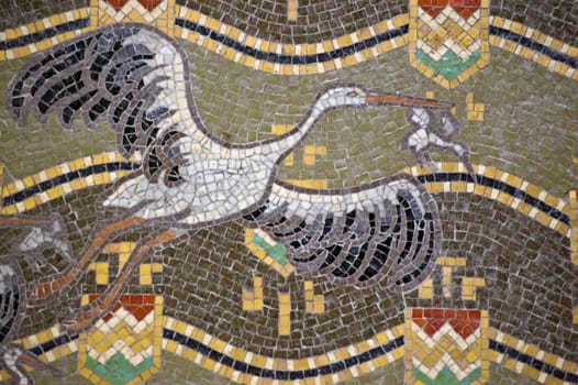 Mosaic showing white storks flying. Latin name for the bird is Ciconia ciconia. Outside wall of the Hungarian Pavilion, Giardini, Venice. Building open to the public to exhibit during the Biennale.