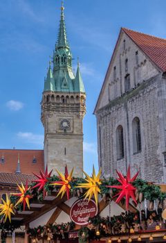 Brunswick, Lower Saxony, Germany, December 7th 2017: The old town hall and the cathedral in the background of the Christmas market of Brunswick