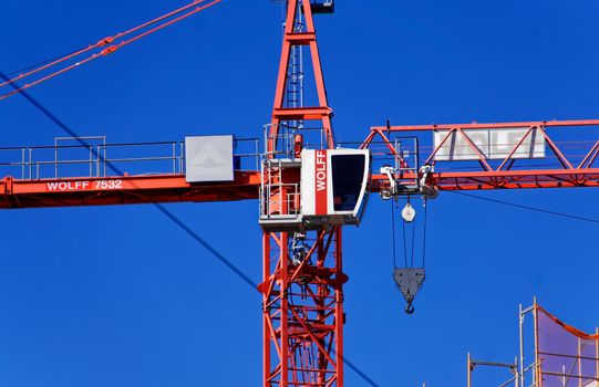 Leipzig, Saxony, Germany, October 21, 2017:  Zoom view of the cab of a construction crane on a construction site