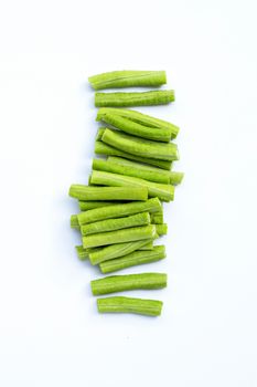 Cut long bean or cowpea on white background. Copy space